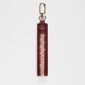 Lululemon | never lost keychain | deep luxe wordmark